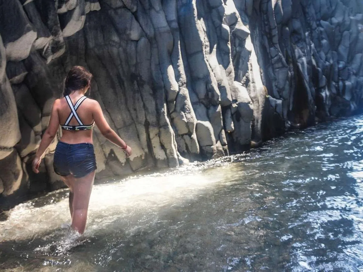 Hexagonal basalt columns rising from the Alcantara River