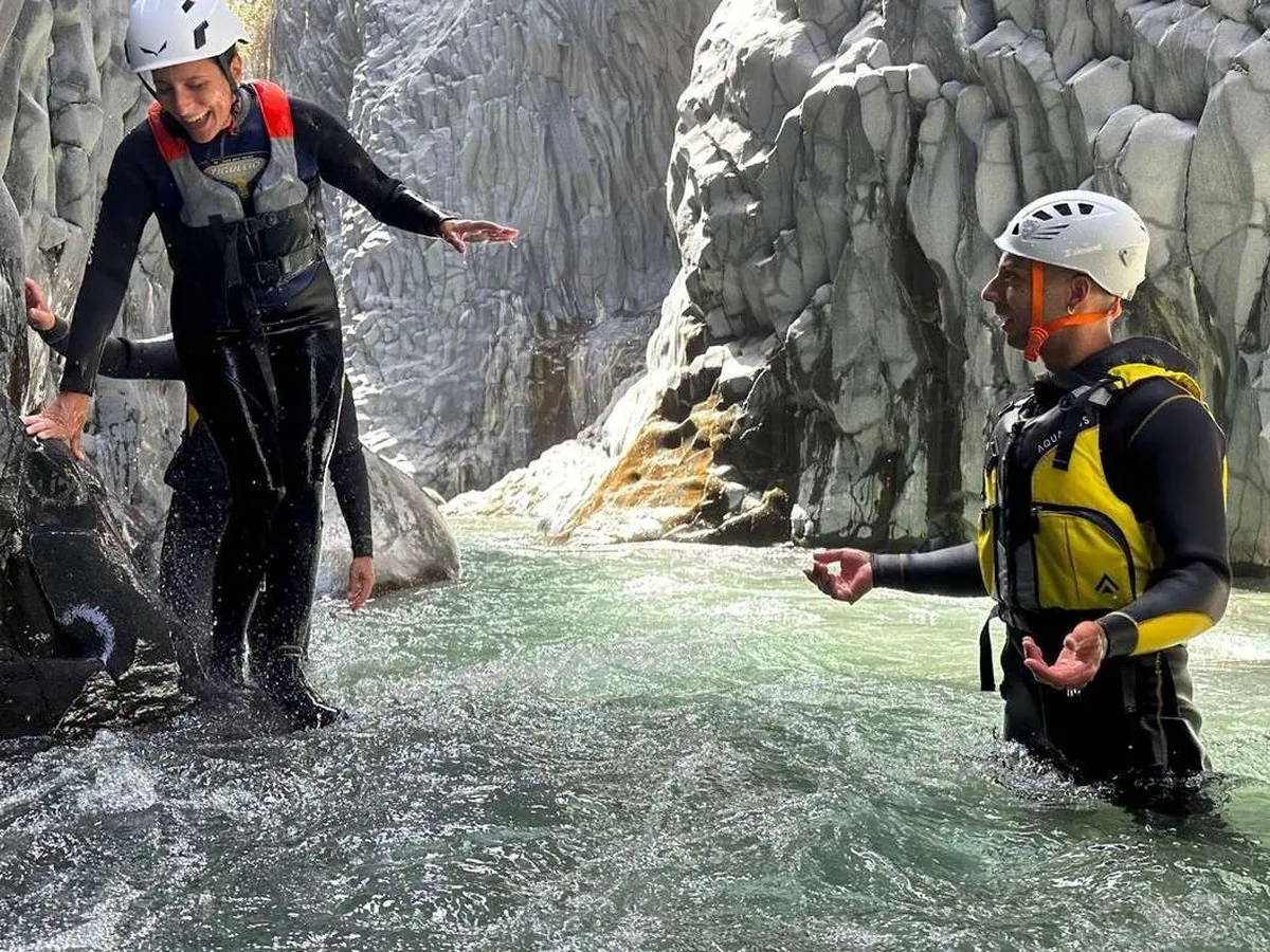 Rafters body-rafting upstream through the narrow gorge